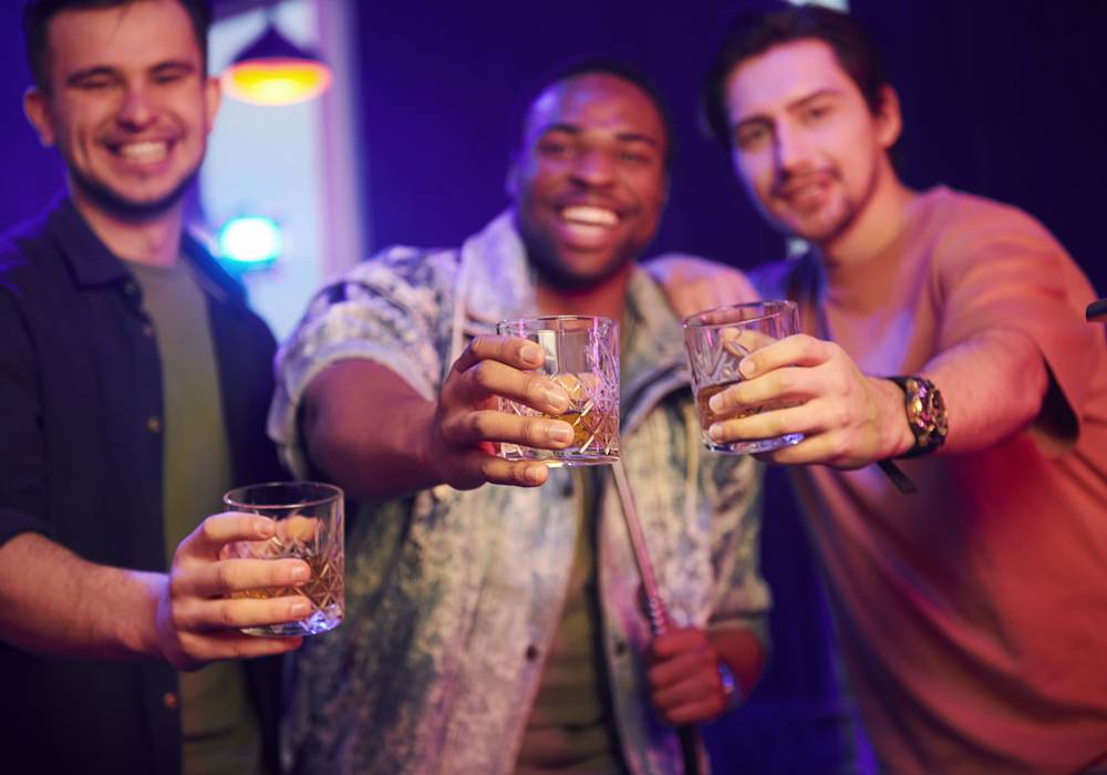 Three guys enjoying drinks in Miami.