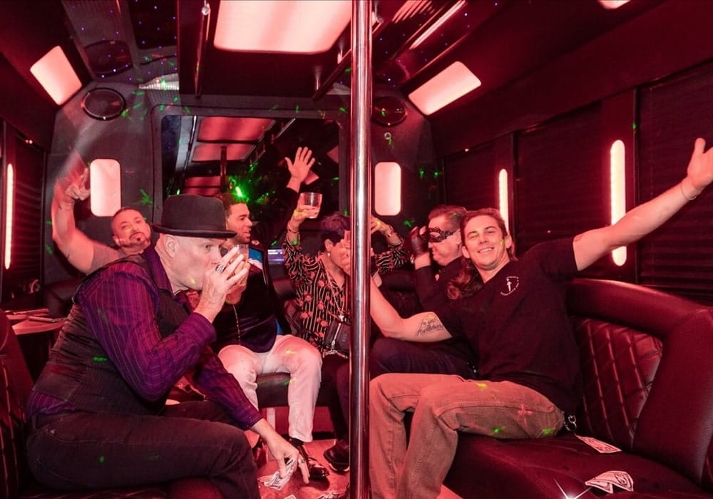 Bachelor party group enjoying a brewery tour on a party bus.