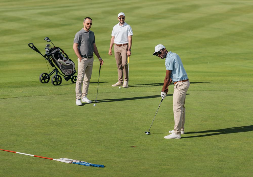 Golf group of three men on the course in Austin.