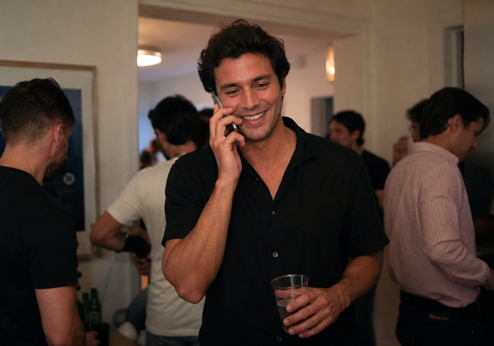 Man at a party calling Bad Girl Productions™ in San Francisco.