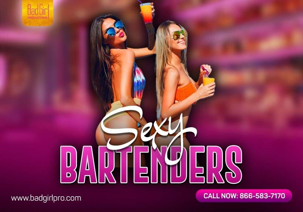 Young female bartenders in bikini, posing while holding glasses.